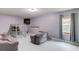 Cozy bedroom featuring a lofted bed, comfortable seating, and a wall-mounted television at 2005 Ashton Pointe Dr, Dacula, GA 30019