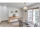 Cozy breakfast nook featuring a glass table and a window with natural light, adjacent to the kitchen at 2005 Ashton Pointe Dr, Dacula, GA 30019