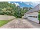 Spacious driveway and a two-car garage providing ample parking at 2005 Ashton Pointe Dr, Dacula, GA 30019