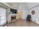 Cozy living room with a fireplace, wood-style flooring, and a vaulted ceiling at 2005 Ashton Pointe Dr, Dacula, GA 30019