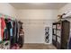 Spacious walk-in closet with wood floors and ample hanging storage space at 2005 Ashton Pointe Dr, Dacula, GA 30019