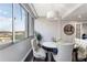 Cozy dining space with a round table, chandelier, and a serene view from the window at 215 Piedmont Ne Ave # 1001, Atlanta, GA 30308