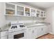 Functional kitchen with white cabinetry, granite countertops, and modern appliances at 215 Piedmont Ne Ave # 1001, Atlanta, GA 30308