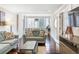 Bright living space with comfortable couches, stylish decor, and city views at 215 Piedmont Ne Ave # 1001, Atlanta, GA 30308