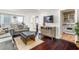 The open-concept living area features wood floors and flows into the kitchen at 215 Piedmont Ne Ave # 1001, Atlanta, GA 30308