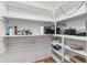 Organized pantry with shelving, ideal for storing kitchen appliances and household goods at 215 Piedmont Ne Ave # 1001, Atlanta, GA 30308