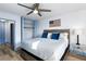 Comfortable bedroom with closet, wood floors, queen bed, and modern ceiling fan at 215 Piedmont Ne Ave # 2208, Atlanta, GA 30308