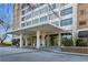 Inviting building entrance with covered portico, offering convenient access and curb appeal at 215 Piedmont Ne Ave # 2208, Atlanta, GA 30308