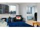 A cozy living room features hardwood floors, comfortable seating, and a stunning city view through large windows at 215 Piedmont Ne Ave # 2208, Atlanta, GA 30308