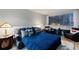 Cozy living room featuring a sofa bed, comfortable seating, city views, and hardwood floors at 215 Piedmont Ne Ave # 2208, Atlanta, GA 30308