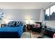 Comfortable living room featuring a sofa bed, city views, and hardwood floors at 215 Piedmont Ne Ave # 2208, Atlanta, GA 30308