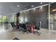 Spacious lobby with modern design, including stone accent wall and large conference table with seating at 215 Piedmont Ne Ave # 2208, Atlanta, GA 30308