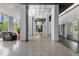 Spacious lobby with modern decor, columns, stylish lighting, and comfortable seating areas at 215 Piedmont Ne Ave # 2208, Atlanta, GA 30308