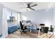 Office space with a large window, an adjustable desk, and laminate flooring at 215 Piedmont Ne Ave # 2208, Atlanta, GA 30308