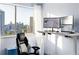 Office space showcasing the city view, an adjustable desk and laminate flooring at 215 Piedmont Ne Ave # 2208, Atlanta, GA 30308