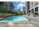 Inviting outdoor pool with clear water and a brick-lined edge, offering a refreshing escape at 215 Piedmont Ne Ave # 2208, Atlanta, GA 30308