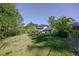 Wide backyard with green grass and a charming two-story house in the background at 2637 Elkhorn Dr, Decatur, GA 30034