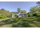 Expansive backyard featuring lush green grass and a charming two-story house in the background at 2637 Elkhorn Dr, Decatur, GA 30034