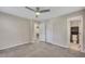 Spacious bedroom with carpet, a ceiling fan, and an open bathroom at 2637 Elkhorn Dr, Decatur, GA 30034