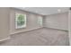 Spacious room with neutral carpet, recessed lighting, and bright windows at 2637 Elkhorn Dr, Decatur, GA 30034