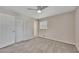 Cozy bedroom with carpet, a ceiling fan, window and a spacious closet at 2637 Elkhorn Dr, Decatur, GA 30034