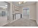Open dining room features a modern light fixture and a built-in bar for entertaining at 2637 Elkhorn Dr, Decatur, GA 30034