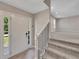 Welcoming entryway featuring tiled floors, stairs, and a bright white front door at 2637 Elkhorn Dr, Decatur, GA 30034