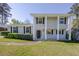 Classic home design with bold columns, gray paint, and a manicured lawn at 2637 Elkhorn Dr, Decatur, GA 30034