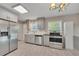 Well-lit kitchen featuring stainless steel appliances, stone countertops, and hardwood flooring at 2637 Elkhorn Dr, Decatur, GA 30034