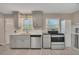 Fully updated kitchen featuring stainless steel appliances, stone countertops, and hardwood flooring at 2637 Elkhorn Dr, Decatur, GA 30034