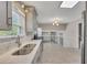Modern kitchen featuring stainless steel appliances, quartz countertops, and wood floors at 2637 Elkhorn Dr, Decatur, GA 30034