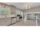 Well-lit kitchen featuring stainless steel appliances and stone countertops at 2637 Elkhorn Dr, Decatur, GA 30034