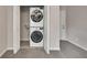Stacked washer and dryer inside the utility closet at 2637 Elkhorn Dr, Decatur, GA 30034