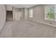 Large living area featuring neutral carpet, recessed lights, and a staircase at 2637 Elkhorn Dr, Decatur, GA 30034