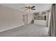 Open living area featuring a ceiling fan with access to the kitchen and deck at 2637 Elkhorn Dr, Decatur, GA 30034