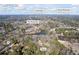 Aerial view showcasing the lake, mature trees, and landmarks, including Stone Mountain at 3000 Cathedral Place Pl, Decatur, GA 30034
