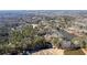 Aerial view of home surrounded by lush greenery and trees near a lake in a serene setting at 3000 Cathedral Place Pl, Decatur, GA 30034