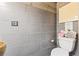 Chic bathroom features gray tiling, a modern toilet, and elegant decorative accents for a luxurious feel at 3000 Cathedral Place Pl, Decatur, GA 30034