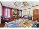 Large suite features custom zodiac themed ceiling, fireplace and rich wood details at 3000 Cathedral Place Pl, Decatur, GA 30034