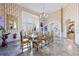 Formal dining room with an ornate table and chairs, large window, and elaborate decorative elements at 3000 Cathedral Place Pl, Decatur, GA 30034