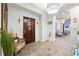 Grand foyer with a dark wood door, tile flooring, and elegant furnishings creating an inviting atmosphere at 3000 Cathedral Place Pl, Decatur, GA 30034