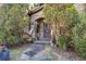 An inviting front entrance with stone accents and decorative foliage, providing a warm and welcoming appeal at 3000 Cathedral Place Pl, Decatur, GA 30034