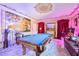 Game room features a pool table, marble floors, ornate fireplace, and decorative artwork at 3000 Cathedral Place Pl, Decatur, GA 30034