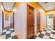 Hallway features black and white checkerboard floors and warm, inviting wall tones at 3000 Cathedral Place Pl, Decatur, GA 30034