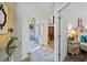 Bright hallway with marble floors, white walls, and arched doorways leading to other rooms in the home at 3000 Cathedral Place Pl, Decatur, GA 30034