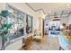 Bright and spacious living room featuring a large window, elegant furniture, and decorative lighting fixtures at 3000 Cathedral Place Pl, Decatur, GA 30034
