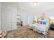 Bright main bedroom features a designer bed frame, a zebra rug, and calming neutral wall colors at 3000 Cathedral Place Pl, Decatur, GA 30034