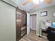 Office area with unique barn door at 199 Candy Ln, Canton, GA 30115