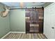 Bedroom features decor and unique barn door at 199 Candy Ln, Canton, GA 30115