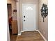 Inviting foyer with modern wood-look flooring, fresh paint, and a stylish accent tree at 199 Candy Ln, Canton, GA 30115